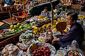 Thailand, Locals sell fruits, food and products at Damnoen Saduak floating market near Bangkok 